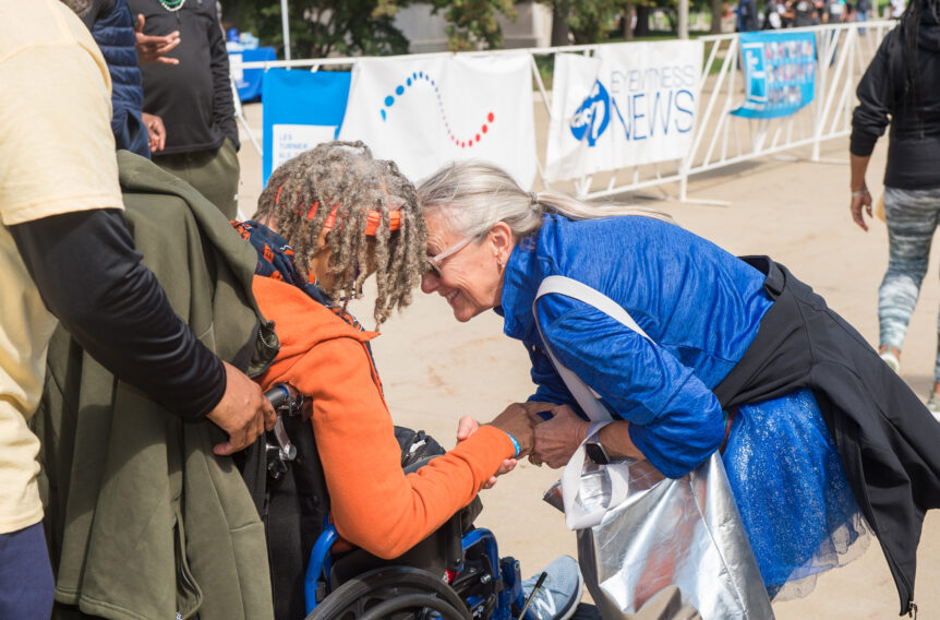 Julie Stowell embraces Anita Forte at the 2022 ALS Walk for Life
